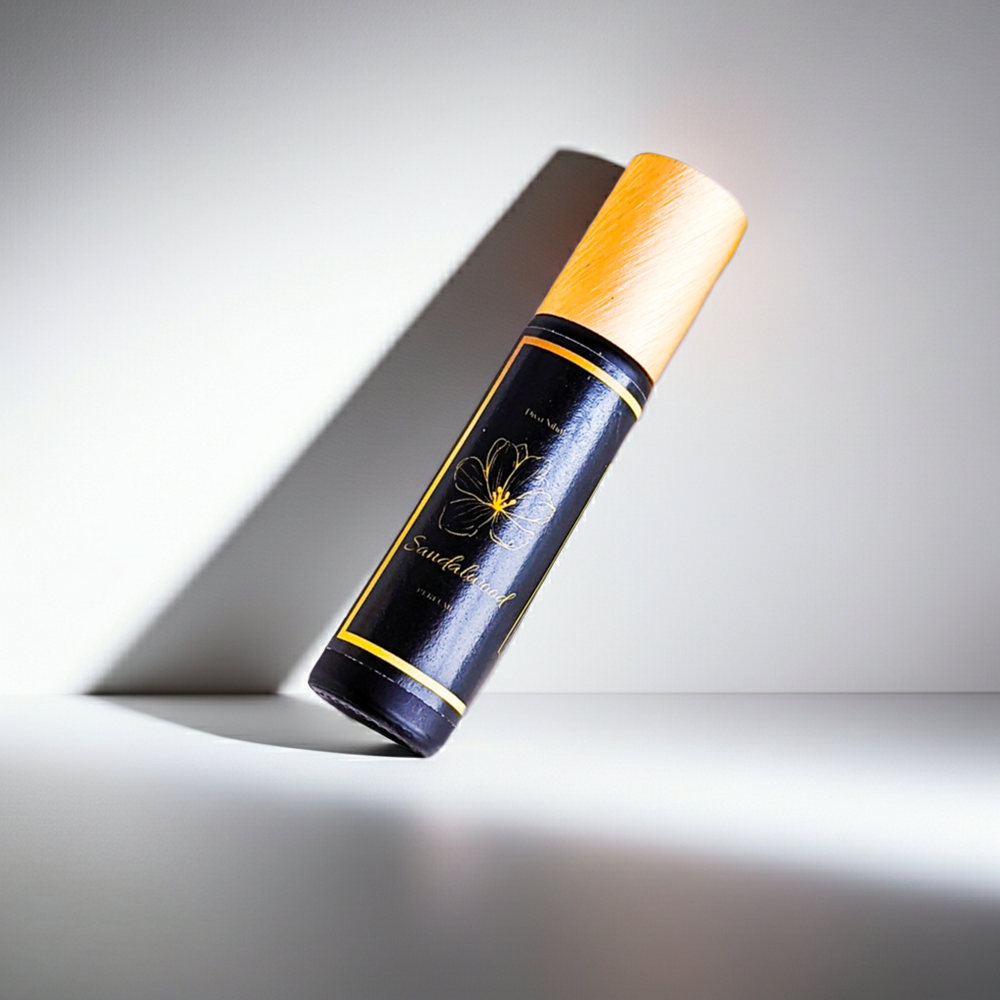 Black and orange cylindrical product with a floral design on a gray background