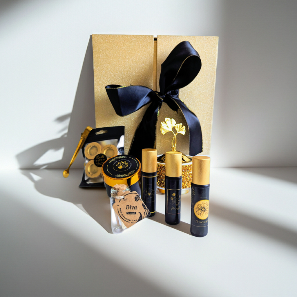Set of skincare products with gold and black packaging on a white background