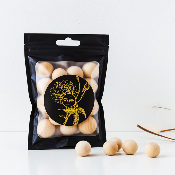 Packaged wooden balls with a brand logo on a white background