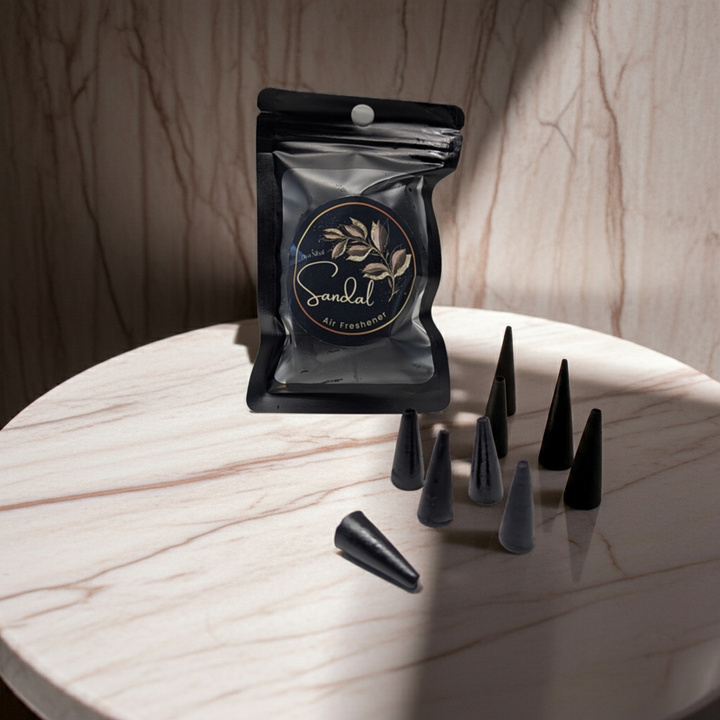 Black cone-shaped items with a packaging labeled &