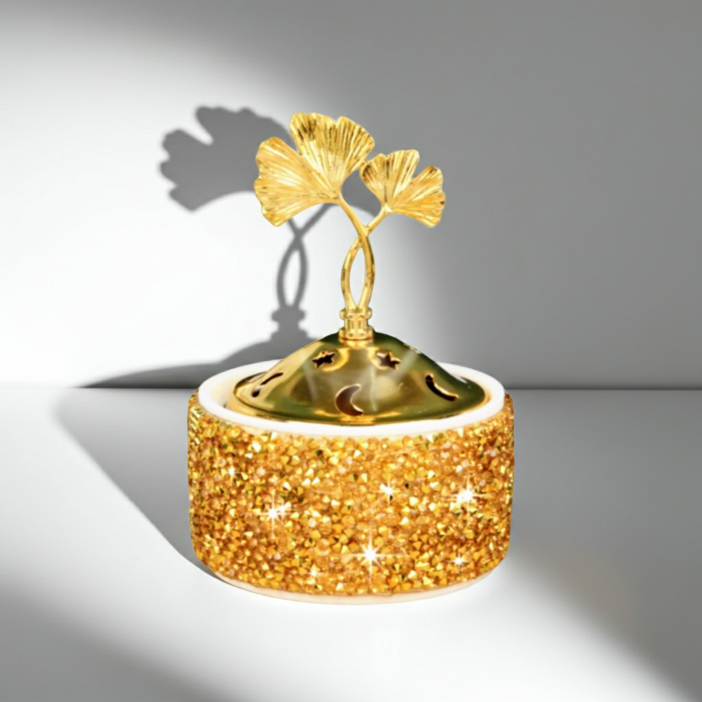 Decorative item with gold tree design on a white background